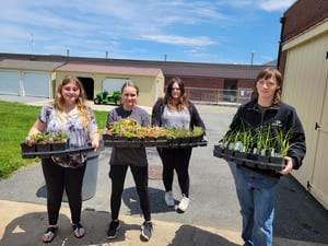 students donating plants